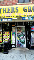 Brother Grocery, 6125 5th Ave, Brooklyn, NY with poster designs for Heineken byMaria Dominguez for Bodega Cultural NYC